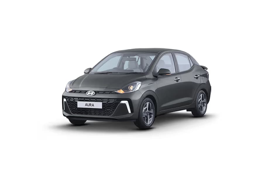 Hyundai Aura 1.2 E Sedan Petrol car front three-quarter view India 2026 price mileage safety specs side by side car comparison vs Maruti Suzuki Dzire AiCarAdvisor