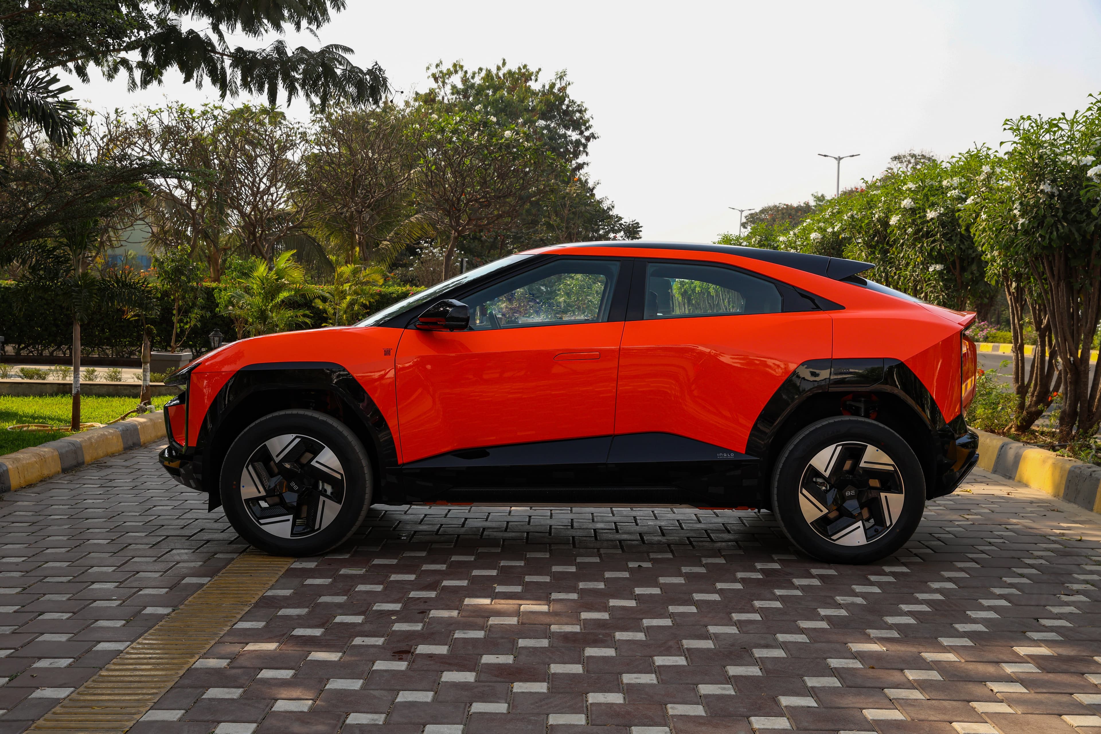 Mahindra BE 6 Pack One Coupe Electric car front three-quarter view India 2026 price mileage safety specs side by side car comparison vs Tata Curvv EV AiCarAdvisor