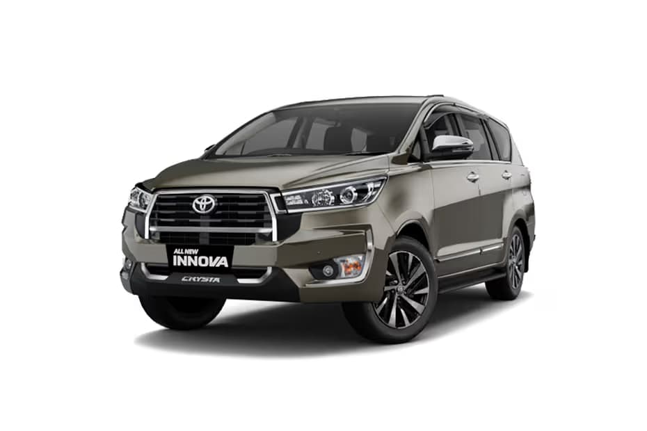 Toyota Innova Crysta 2.4 GX 7Str Platinum White Pearl MUV Diesel car front three-quarter view India 2026 price mileage safety specs side by side car comparison vs Kia Carens AiCarAdvisor