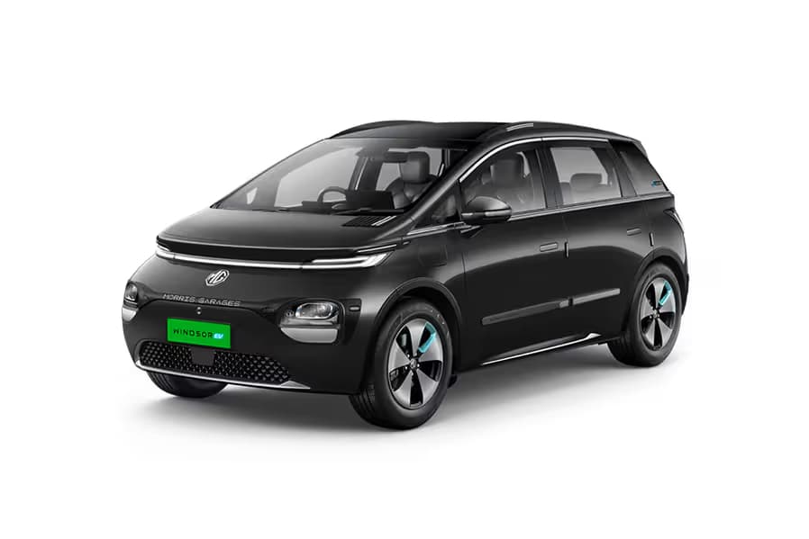 MG Windsor EV Excite Hatchback Electric car front three-quarter view India 2026 price mileage safety specs side by side car comparison vs Tata Tiago EV AiCarAdvisor